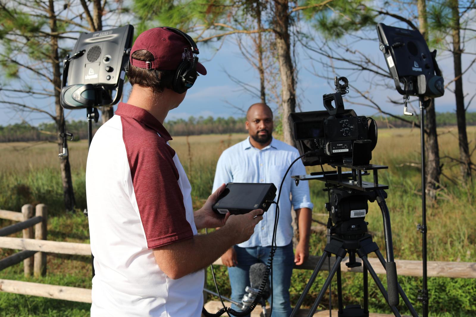 UTC staff filming subject outdoors